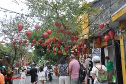 Busy street, many tourists.